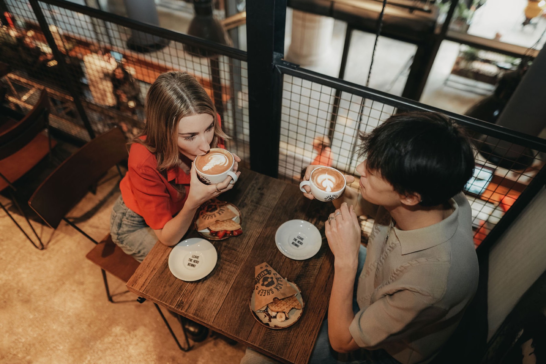 Coffee and food on a table in the store interior.