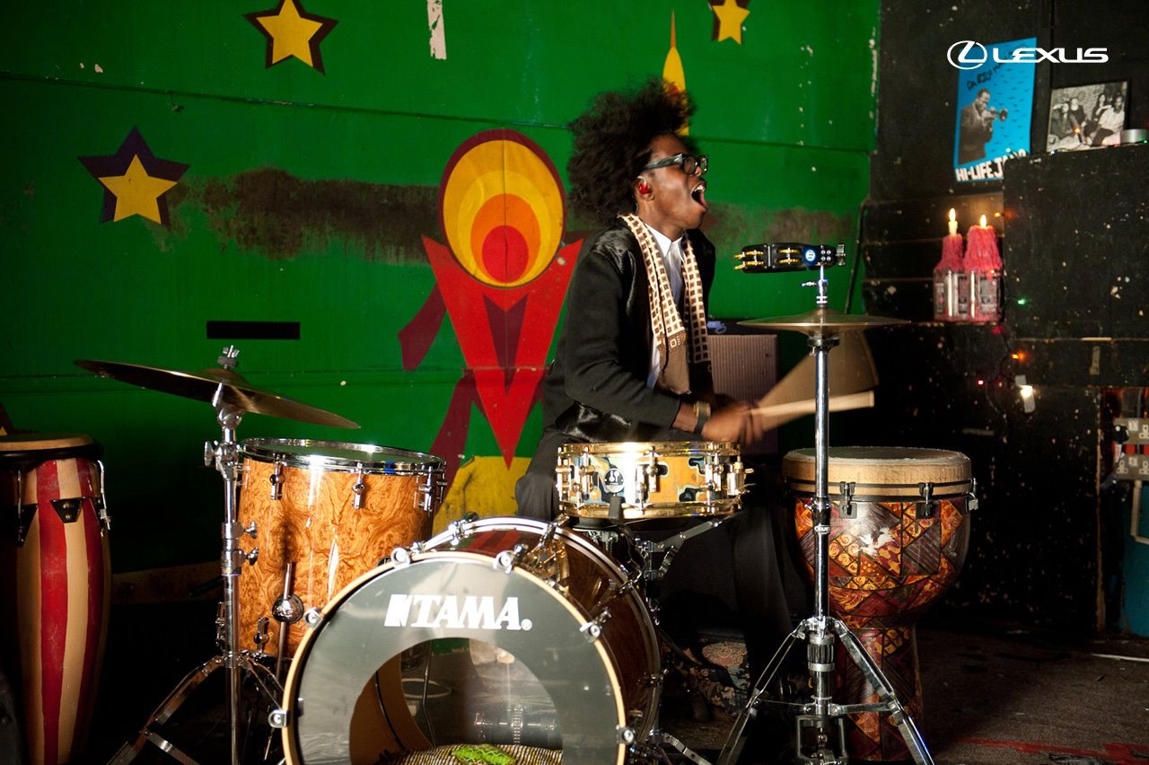 Pauli behind a full percussion setup.