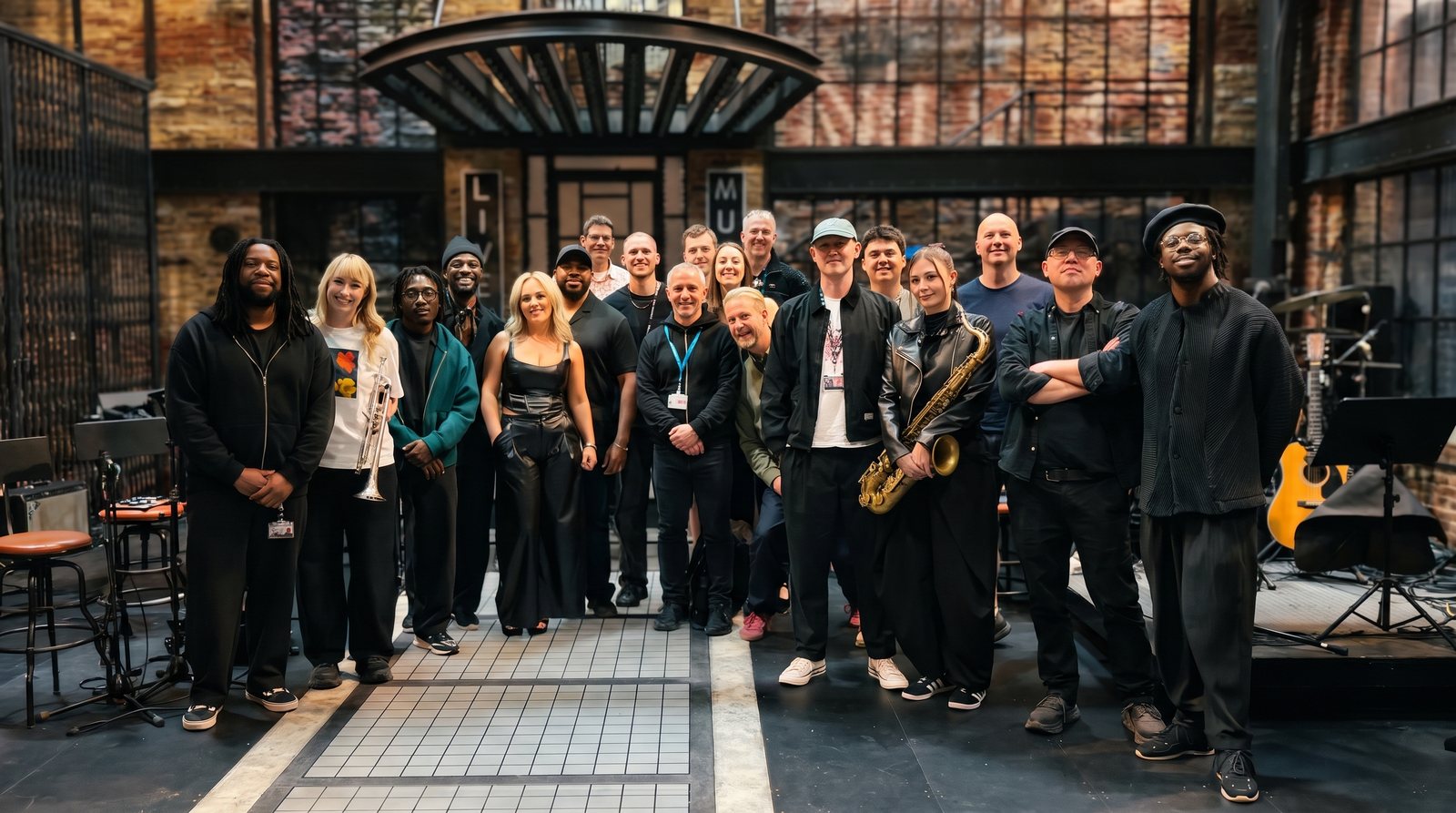 Cast and band on the Saturday Night Live UK set.